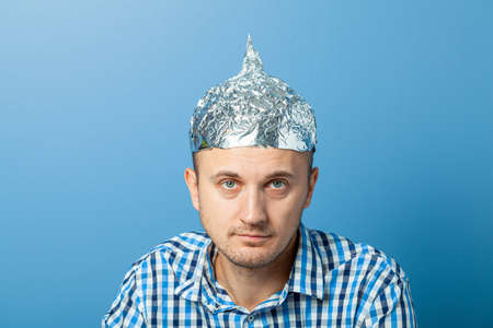 146746788-foil-hat-on-man-protects-from-reading-think